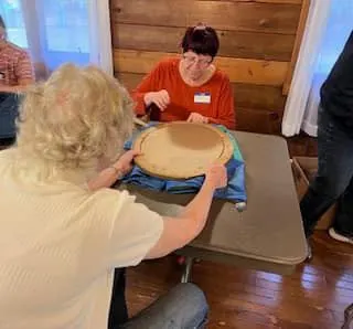 Two people sitting across from each other at a table.
